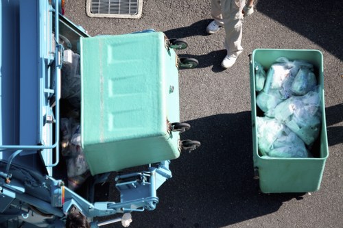 Workers wearing PPE and setting up safety signage